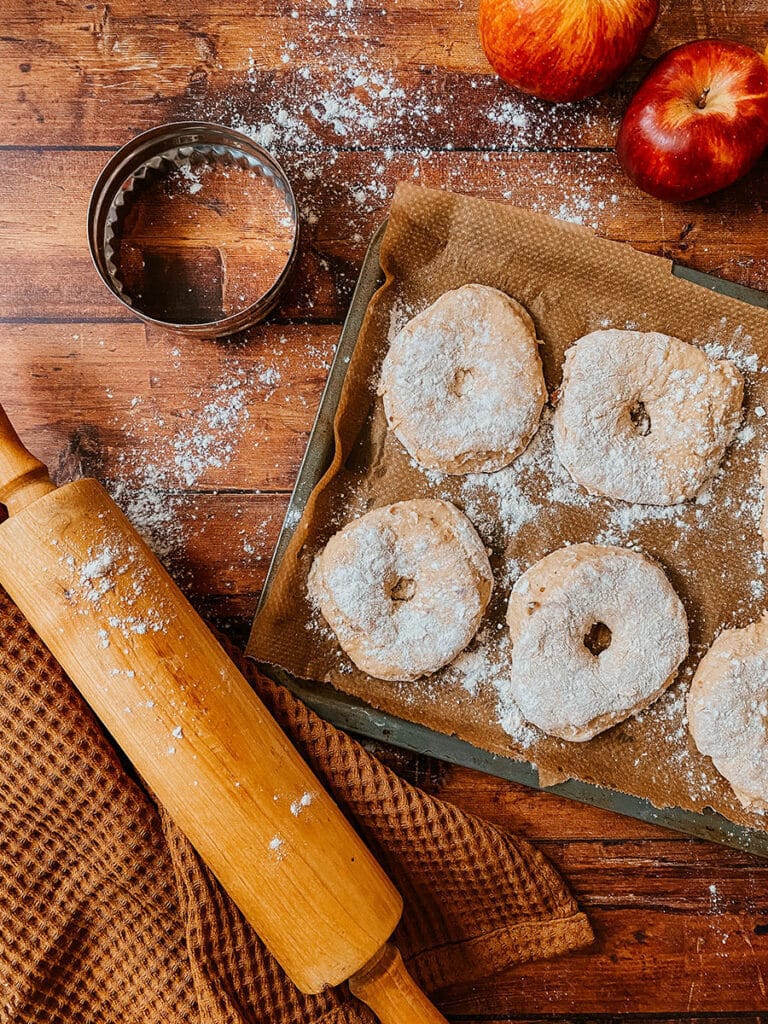Delicious Vegan Apple Cider Doughnuts Recipe 6 vegan apple cider donuts being shaped