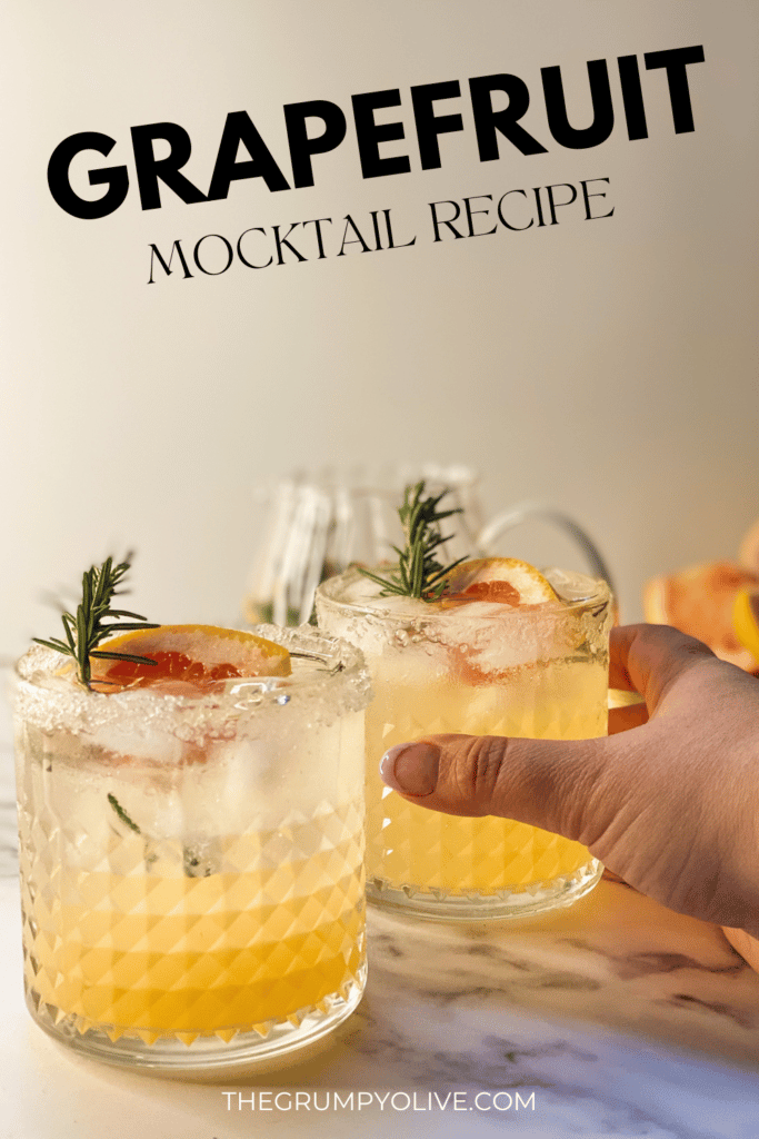 Amazing Sparkling Grapefruit Mocktail Recipe 8 two crystal tumblers filled with grapefruit rosemary cocktails on a marble slate