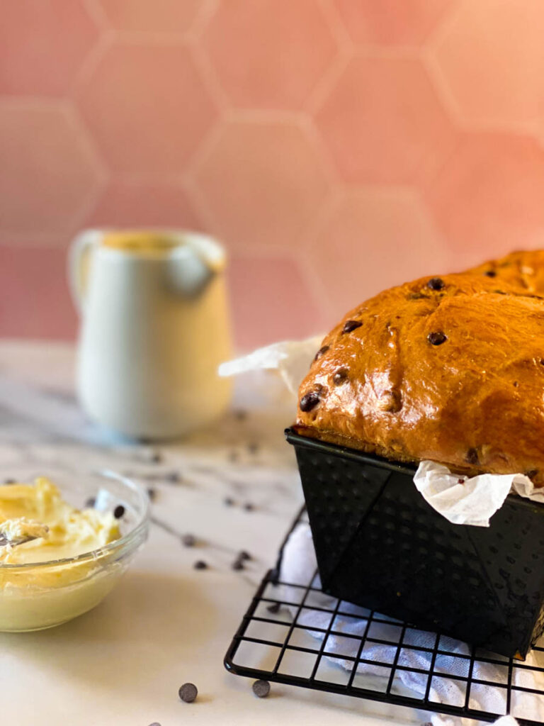 Delicious Fluffy Chocolate Chip Brioche Recipes 4 close up of chocolate chip brioche in a tin, milk and butter on the side