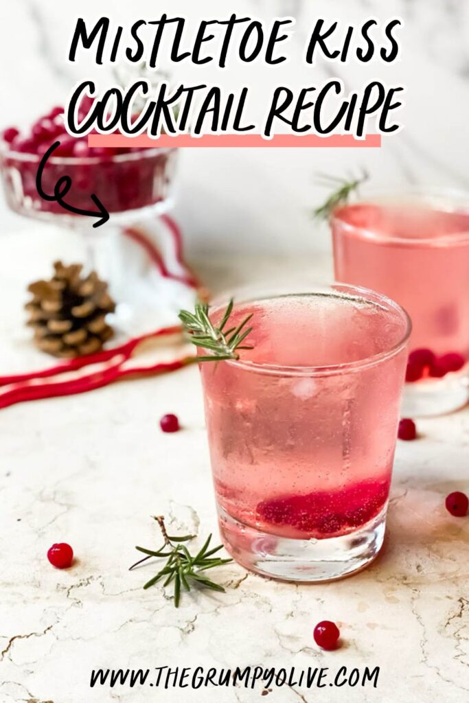 Super Mistletoe Kiss Cocktail Recipe for a Jolly Holiday Season 9 mistletoe kiss cocktail glasses with fresh rosemary and a red ribbon on the background