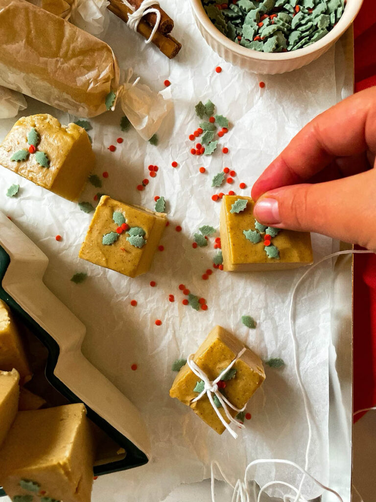 Easy No Bake Peanut Butter Fudge: Unwrap the Magic of The Best Christmas 8 easy no bake peanut butter fudge in a christmas tree dish over on a silver baking tray with christmas sprinkles